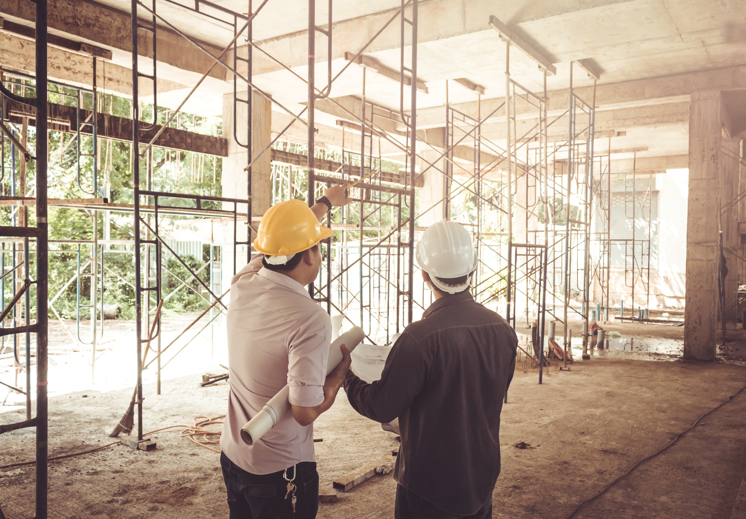 contractor looking at building under construction