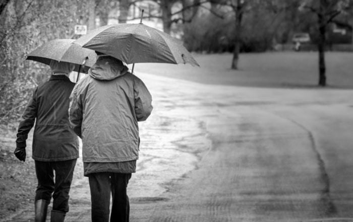 Couple walking in rain
