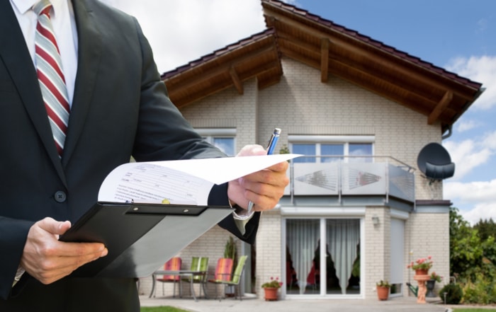 appraiser measuring square footage of a house